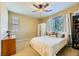 Carpeted bedroom features ceiling fan and natural light at 10931 Sardinia Sands Dr, Las Vegas, NV 89141