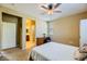 Comfortable bedroom featuring a ceiling fan and neutral colors at 10931 Sardinia Sands Dr, Las Vegas, NV 89141