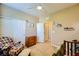 Bedroom with a rocking chair, dresser, and carpet at 10931 Sardinia Sands Dr, Las Vegas, NV 89141
