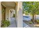 Home's covered front entryway with desert landscaping at 10931 Sardinia Sands Dr, Las Vegas, NV 89141