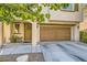 Exterior view of a two-story home with a two-car garage at 10931 Sardinia Sands Dr, Las Vegas, NV 89141