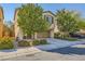 Two-story home with a two-car garage and desert landscaping at 10931 Sardinia Sands Dr, Las Vegas, NV 89141
