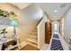 Inviting entryway with staircase, decor, and tiled floor at 10931 Sardinia Sands Dr, Las Vegas, NV 89141