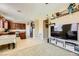 Living room open to kitchen featuring modern decor and tile flooring at 10931 Sardinia Sands Dr, Las Vegas, NV 89141