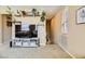 Bright living room with modern décor, neutral colors, and carpet at 10931 Sardinia Sands Dr, Las Vegas, NV 89141