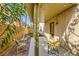 This covered patio includes stylish outdoor furniture and a well-maintained yard at 10931 Sardinia Sands Dr, Las Vegas, NV 89141