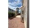 A gravel backyard surrounded by a brick wall at 1153 Stormy Valley Rd, Las Vegas, NV 89123