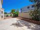 Private backyard featuring concrete patio, block wall and easy-care desert landscaping at 1153 Stormy Valley Rd, Las Vegas, NV 89123