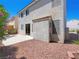Backyard featuring low-maintenance landscaping, concrete patio, and privacy wall for outdoor enjoyment at 1153 Stormy Valley Rd, Las Vegas, NV 89123