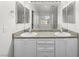 Bathroom featuring dual sinks, ample counter space, and a large mirror for convenience at 1153 Stormy Valley Rd, Las Vegas, NV 89123