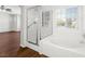 Bathroom showcasing a glass-enclosed shower, a soaking tub, and a window providing natural light at 1153 Stormy Valley Rd, Las Vegas, NV 89123