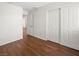 Bedroom with wood-look flooring and closet, offering functional living space at 1153 Stormy Valley Rd, Las Vegas, NV 89123
