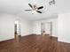 Open bedroom with a ceiling fan and wood-look flooring, perfect for relaxation at 1153 Stormy Valley Rd, Las Vegas, NV 89123