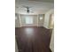 Primary bedroom with ample natural light, ceiling fan, and vinyl floors at 1153 Stormy Valley Rd, Las Vegas, NV 89123