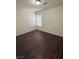 Cozy bedroom featuring vinyl floors, neutral walls, and natural light at 1153 Stormy Valley Rd, Las Vegas, NV 89123