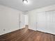 Cozy bedroom with wood-look flooring and closet, offering ample storage at 1153 Stormy Valley Rd, Las Vegas, NV 89123