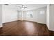 Spacious bedroom featuring wood-look flooring and ample natural light from the windows at 1153 Stormy Valley Rd, Las Vegas, NV 89123
