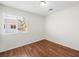 Bright bedroom with wood-look flooring and a window, creating a warm ambiance at 1153 Stormy Valley Rd, Las Vegas, NV 89123