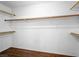 Walk-in closet providing ample storage space with wood shelving and well-maintained interior at 1153 Stormy Valley Rd, Las Vegas, NV 89123