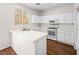 Modern kitchen with white cabinets and stainless steel appliances that is both stylish and functional at 1153 Stormy Valley Rd, Las Vegas, NV 89123