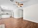 Living room with hardwood floors open to the kitchen with white cabinets at 1153 Stormy Valley Rd, Las Vegas, NV 89123