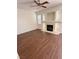 Spacious living room featuring a fireplace, vinyl floors, and neutral walls at 1153 Stormy Valley Rd, Las Vegas, NV 89123