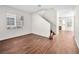 Living room with hardwood floors and staircase to the second floor at 1153 Stormy Valley Rd, Las Vegas, NV 89123
