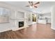 Open floor plan living room featuring hardwood floors, fireplace, and natural light at 1153 Stormy Valley Rd, Las Vegas, NV 89123