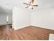 Living room with hardwood floors, front door, and neutral paint palette at 1153 Stormy Valley Rd, Las Vegas, NV 89123