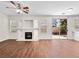 Living room with hardwood floors, fireplace and sliding door at 1153 Stormy Valley Rd, Las Vegas, NV 89123