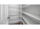 Spacious walk-in pantry with ample shelving for storage at 1153 Stormy Valley Rd, Las Vegas, NV 89123