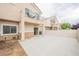 Private backyard with a patio, perfect for outdoor dining and entertaining at 1580 Wild Willey Way, Henderson, NV 89002