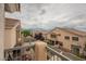 Balcony view of neighboring homes and desert landscape in the distance at 1580 Wild Willey Way, Henderson, NV 89002