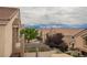Balcony view of the neighboring rooftops and mature trees at 1580 Wild Willey Way, Henderson, NV 89002