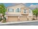 Charming townhome featuring a three-car garage and a quaint balcony at 1580 Wild Willey Way, Henderson, NV 89002