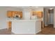 Kitchen with oak cabinets, a breakfast bar, and white appliances at 1580 Wild Willey Way, Henderson, NV 89002