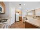 Kitchen with oak cabinets, white appliances, and plenty of counter space at 1580 Wild Willey Way, Henderson, NV 89002