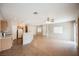 Combined kitchen and living room area with tile floors, providing an open-concept layout at 1580 Wild Willey Way, Henderson, NV 89002