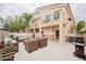 Inviting patio featuring comfortable seating, an outdoor grill, and access to the home's exterior at 1580 Wild Willey Way, Henderson, NV 89002