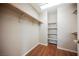 Walk-in closet with wood floor and multiple shelves and storage space at 1580 Wild Willey Way, Henderson, NV 89002