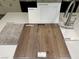 Showcasing flooring samples: carpet, luxury vinyl plank, quartz countertop, cabinet, and faucet at 167 Silver Run Ln, Las Vegas, NV 89138
