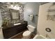 Modern bathroom featuring sleek tiling, a vanity sink, and a glass-enclosed shower at 1800 Edmond St # 218, Las Vegas, NV 89146