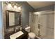Stylish bathroom featuring a modern vanity, tiled walls, and glass-enclosed shower at 1800 Edmond St # 218, Las Vegas, NV 89146