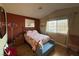Cozy bedroom features a large window with natural light and vibrant bedding at 1800 Edmond St # 218, Las Vegas, NV 89146