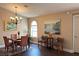Dining area with a glass top table, hardwood floors, and stylish decor at 1800 Edmond St # 218, Las Vegas, NV 89146