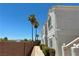Exterior view of a condo building with palm trees, desert landscaping, and a walkway at 1800 Edmond St # 218, Las Vegas, NV 89146