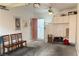 Spacious garage with overhead storage, ceiling fan, and a side access door at 1800 Edmond St # 218, Las Vegas, NV 89146
