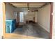 Bright and open garage with cement floor and an access door, perfect for storage or a workshop at 1800 Edmond St # 218, Las Vegas, NV 89146