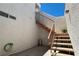 Outdoor stairway with carpeted steps, metal railing, and stucco walls at 1800 Edmond St # 218, Las Vegas, NV 89146