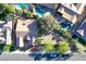 Aerial view showcases the home, its pool, neighboring properties, landscaping, and the surrounding area at 2309 Tedesca Dr, Henderson, NV 89052